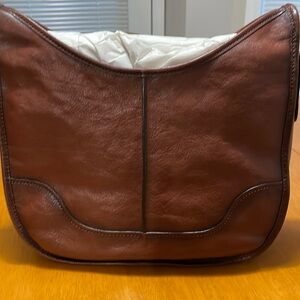 Frye real leather shoulder bag. Adjustable shoulder strap rich color.